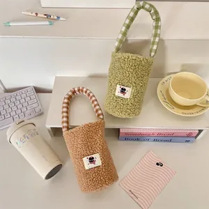 Fuzzy sherpa water bottle carrier bag with plaid handles and cute cartoon patch