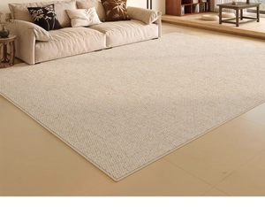 Detailed view of the beige woven texture and non-slip edge of the minimalist living room rug