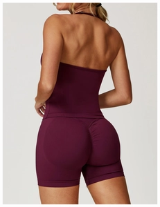 Close-up of seamless yoga vest and scrunch shorts back design in deep purple color