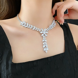 Close-up of sparkling silver zircon wheat ear tassel necklace worn on a female model