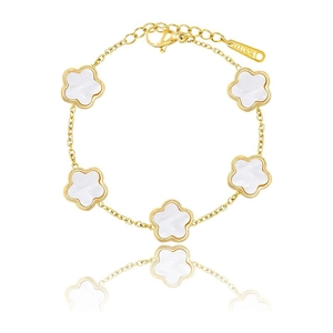Detail of five white flowers on a gold stainless steel bracelet with lobster clasp