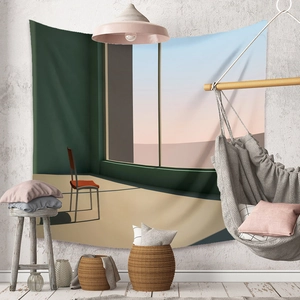 Detail of bohemian tapestry with minimalist red chair and sunset scene in a room