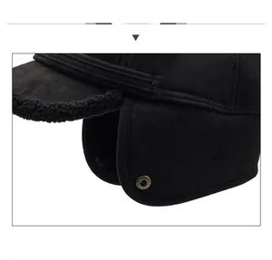 Detail of winter trapper hat showing plush faux fur lining and retro metal snap button