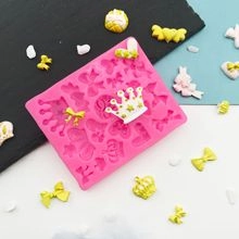 Detailed view of pink silicone bow and crown mold with decorative 3D fondant samples