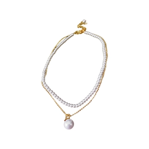 Double-layered gold plated necklace featuring artificial pearl strand and circular pendant
