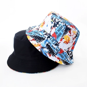 Detail showing reversible tie-dye bucket hat with banana graffiti and black cotton fabric