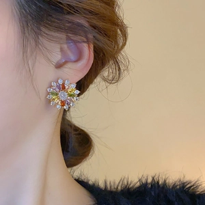 Detailed view of colorful zircon flower stud earrings featuring vibrant petal stones