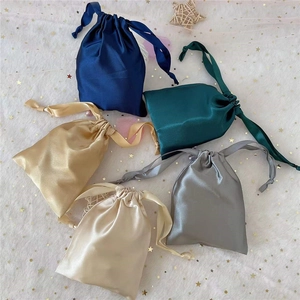 Assorted satin drawstring storage pouches in navy, green, champagne, grey and beige