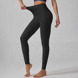 Detail showing the high elasticity and ribbed waistband of black thermal yoga leggings