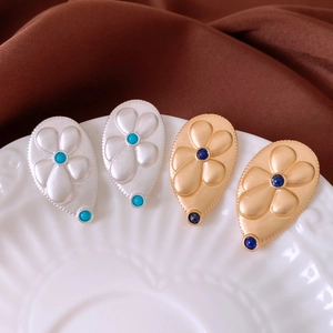 Detailed view of vintage waterdrop flower earrings with turquoise and navy blue stones