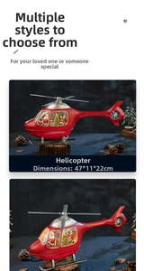 Detail view of red helicopter Christmas music box with Santa scene, 47x11x22cm size