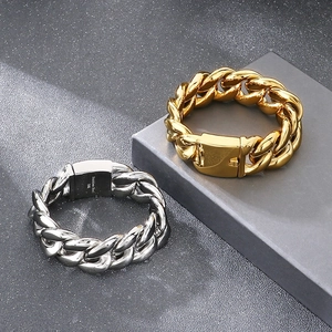 Detailed shot of gold and silver 25mm chunky Cuban bracelets with 316L stainless steel engraving