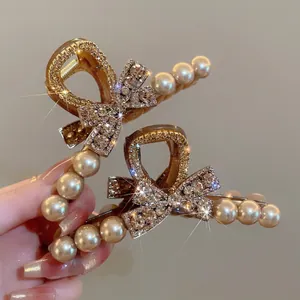 Elegant gold hair claw clip set with crystal butterfly bow and faux pearls decoration