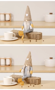 Detail view of handmade faceless gnome dolls with knitted heart hats and coffee cups