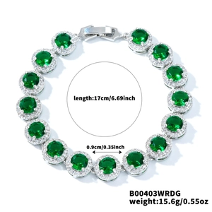 Detail view of silver tennis bracelet with halo-set emerald green zircons and safety clasp