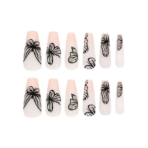 Long coffin press-on nails with nude pink gradient and black butterfly wing design