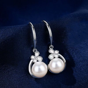Elegant butterfly jewelry set with pearl earrings and shimmering floral rhinestones
