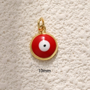Macro shot of 10mm gold plated round evil eye pendant with colorful enamel details