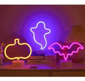 Close-up of Halloween neon lights featuring ghost, pumpkin, and bat shapes with white bases