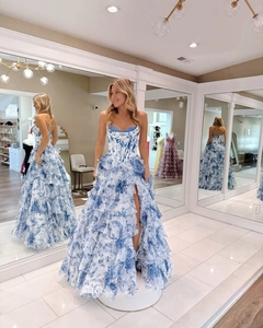 Detail of tiered ruffles and blue floral print on this elegant strapless evening gown