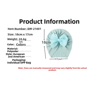 Infographic showing dimensions and weight of a blue ribbed baby turban with big bow