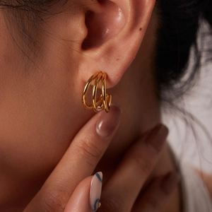 French style 18K gold plated triple hoop earrings for women on a female model