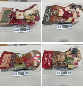 Detail view of plush Christmas stockings with 3D characters on weighing scale for quality check
