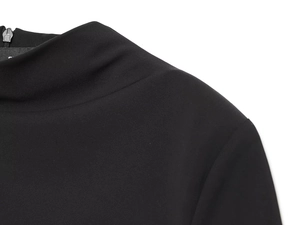 Detail shot of black high-neck dress showing the seamless invisible back zipper closure