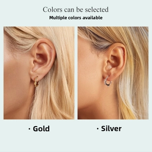 Detailed view of s925 sterling silver hoop earrings with gold and silver twisted rope design