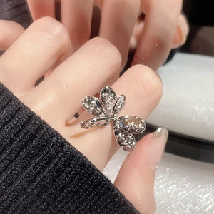 Elegant silver butterfly open ring with sparkling cubic zirconia on a female model