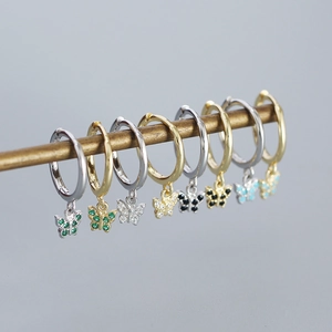 Detail of s925 silver butterfly earrings featuring colorful inlaid cubic zirconia stones