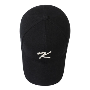 Classic black cotton baseball cap with white 3D letter K embroidery, top view display