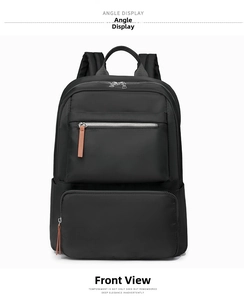 Detailed front view of black nylon backpack featuring durable zippers and leather pullers