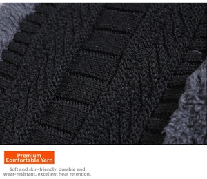 Detailed close-up of cable-knit black yarn with thick thermal grey fleece lining texture