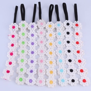 Detailed set of eight white lace daisy headbands with multi-colored center details