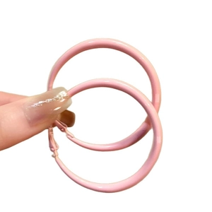 Pink enamel round hoop earrings for women shown on a clean white background