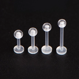 Clear acrylic labret stud set with four different lengths for lip and cartilage piercing