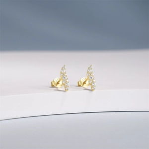 Detailed macro shot of S925 sterling silver gold stud earring with fine cubic zirconia stones