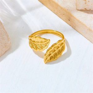 Macro shot of 18K gold plated stainless steel open ring with detailed twin leaf design