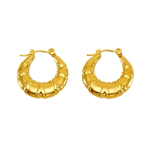 Detail of 18K gold-plated stainless steel hoop earrings with bamboo texture design