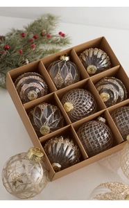 Detail of Christmas tree ornaments with champagne gold sequins and glitter patterns