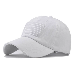 Close-up of white washed cotton baseball cap featuring distressed brim and flag embroidery