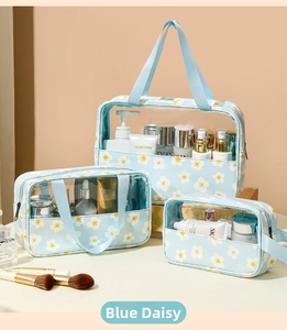 Three-piece transparent PVC wash bag set with blue daisy prints for travel storage