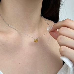 Detailed close-up of a square yellow zircon necklace pendant on an S925 silver chain