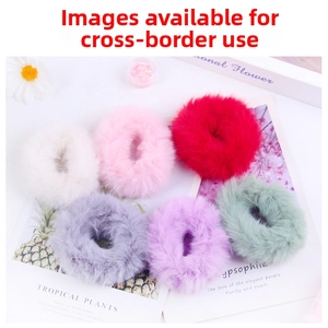 Flat lay of soft faux fur hair scrunchies in 6 pastel colors for high ponytails