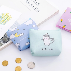 Flat lay of small PU leather coin purses with cartoon prints and metal zippers
