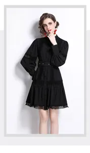 Detail of elegant black lace lantern sleeve dress with button-down front and waist belt