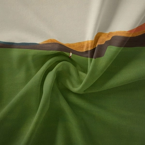 Close-up detail of Bohemian landscape tapestry fabric with soft textures and artistic folds