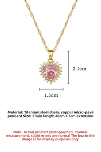 Detail of gold heart pendant with pink stone and micro-pave crystals on titanium chain
