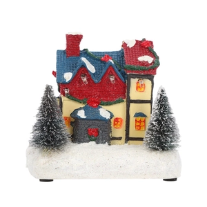 Lighted Christmas village house with snow-covered trees and LED glow for home decor